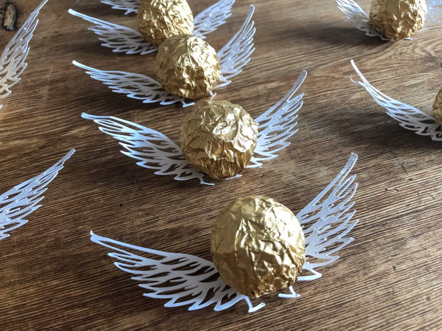 Golden snitch party chocolates and Cricut paper cutting art projects 
