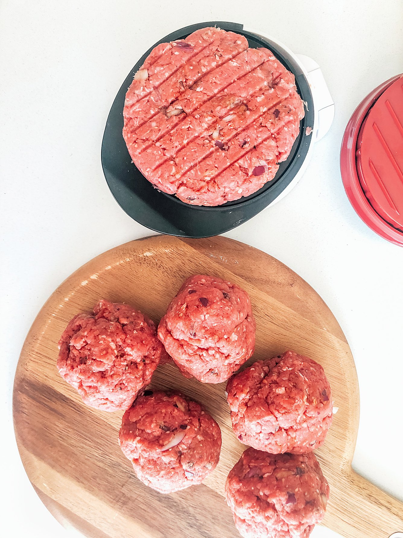 Now weight your burger patty mixture and split between 3 equal portions before using a burger press to form the patty