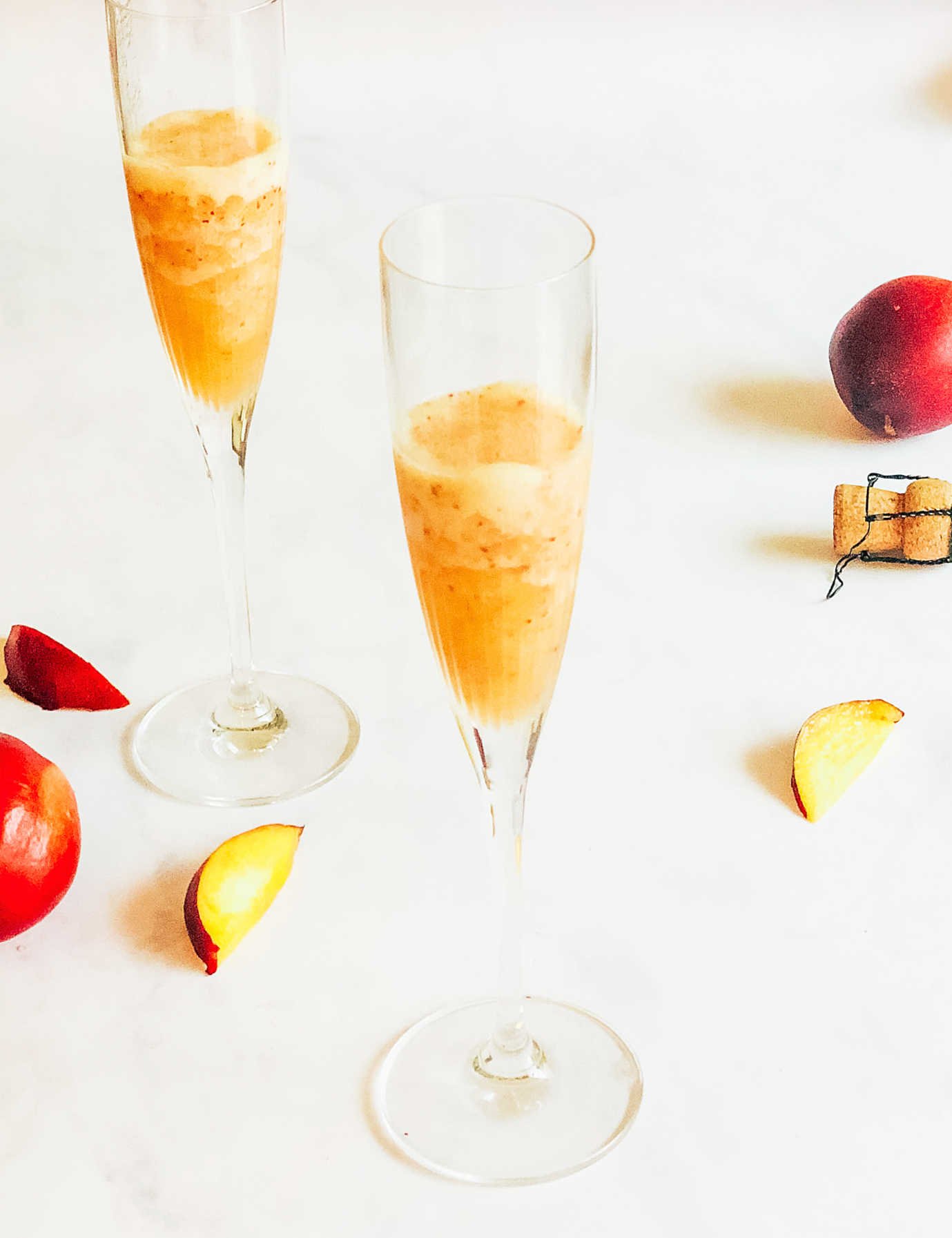 Add the peach mixture to the bottom of the Champagne glass 
