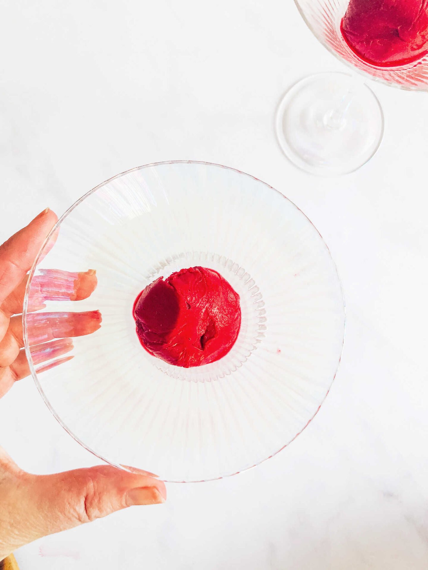 Add the sorbet to the bottom of the glass before drizzling with cherry juice