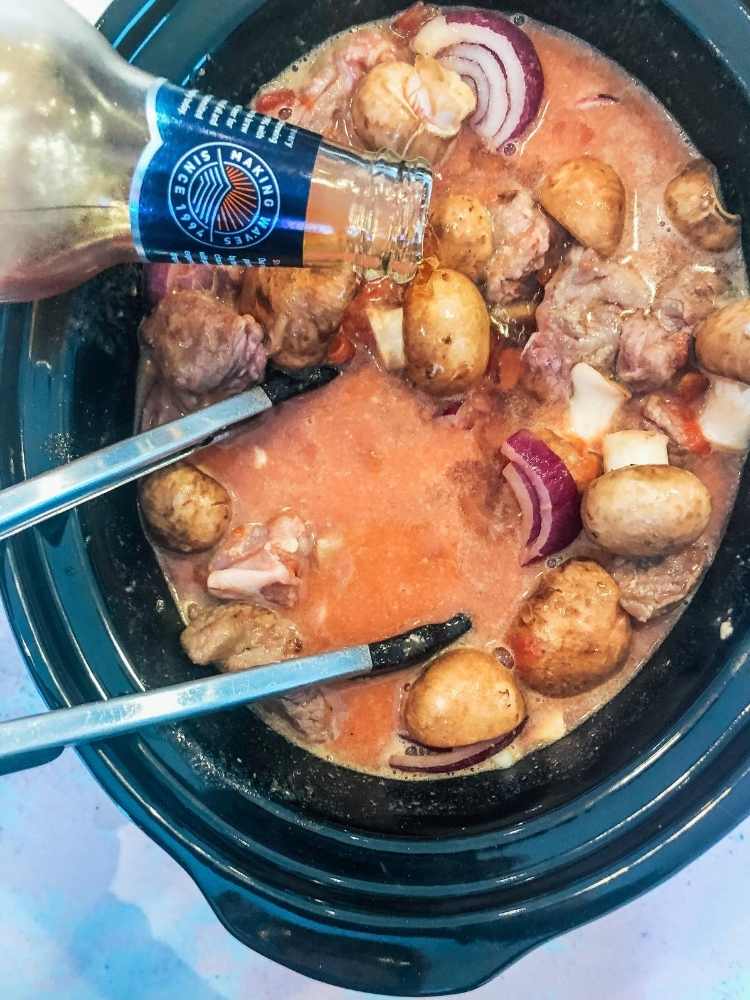Pour the ale into the slow cooker