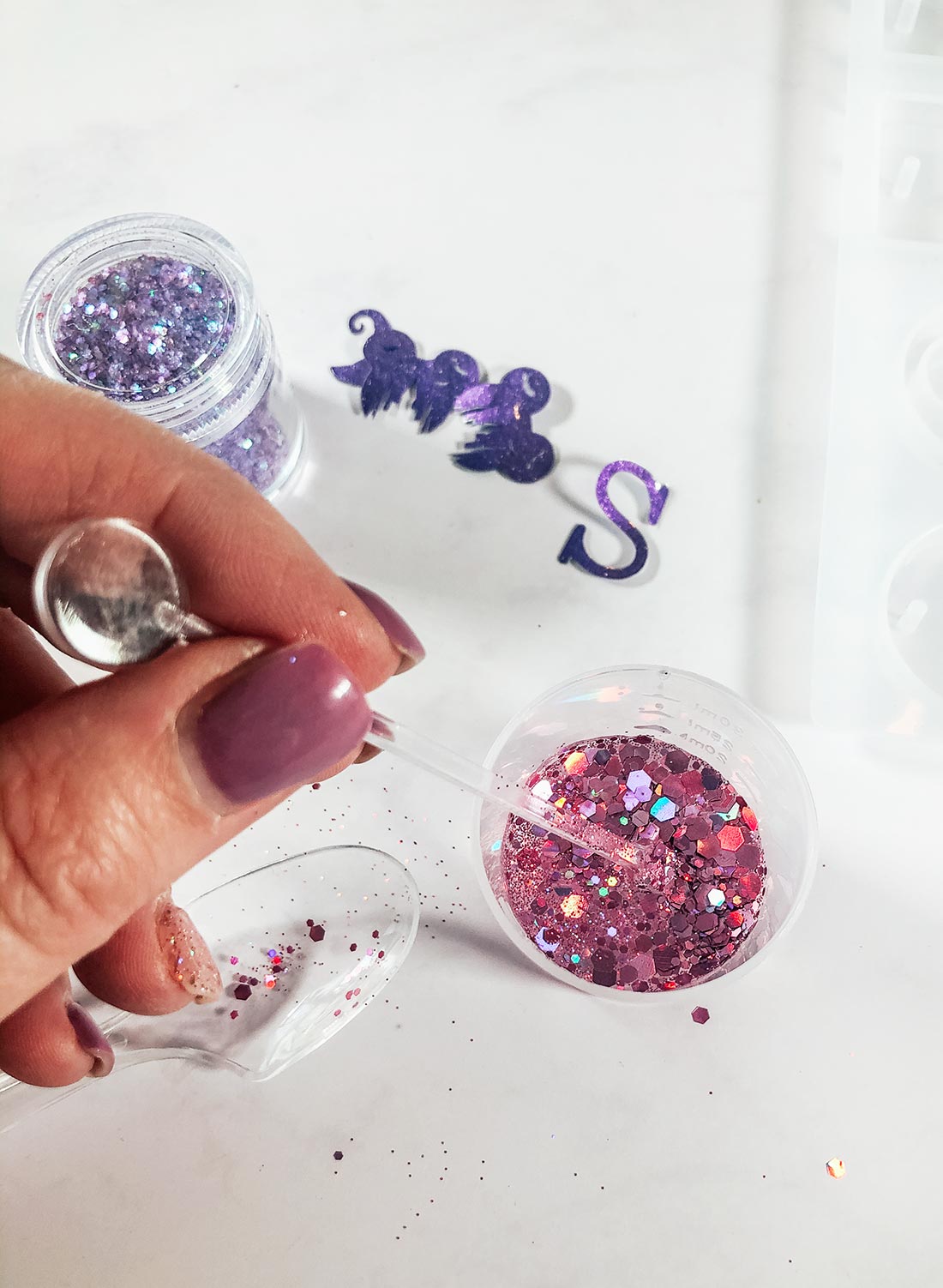 You can mix the glitter into your resin or sprinkle it in the encapsulate