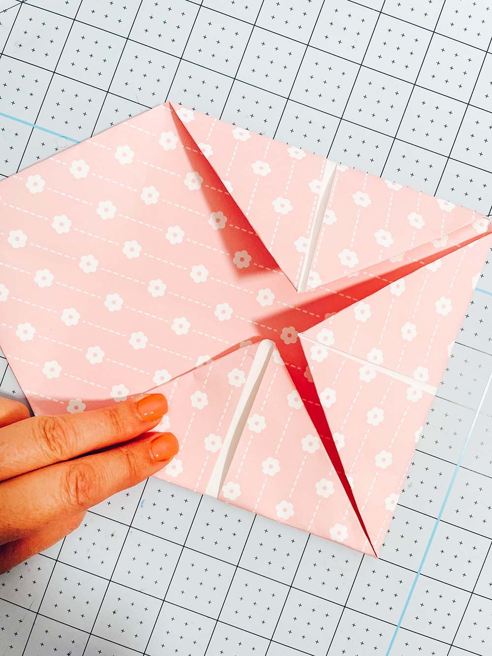 fold the corners of your paper fortune tellers inways to make a square