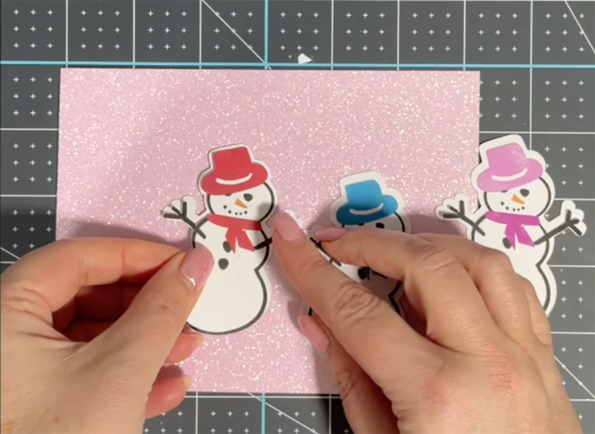 Attach your snowman png clip art files to the the offset background
