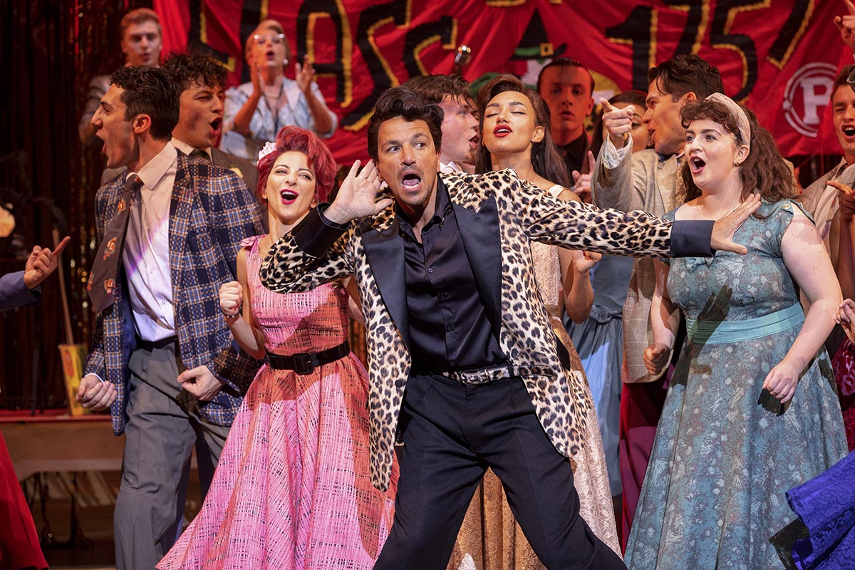 Peter Andre (front centre) as Vince Fontaine in Grease, credit Sean Ebsworth Barnes