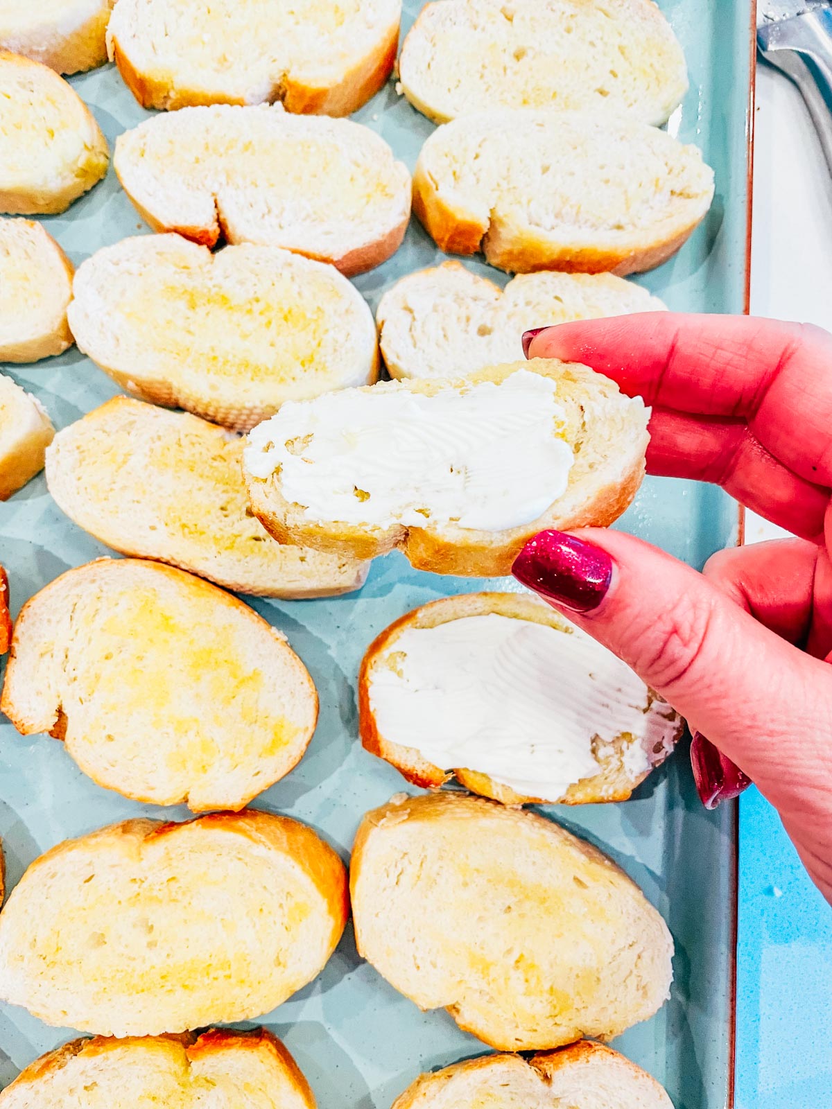 Spread a small amound of cream cheese on each crostini