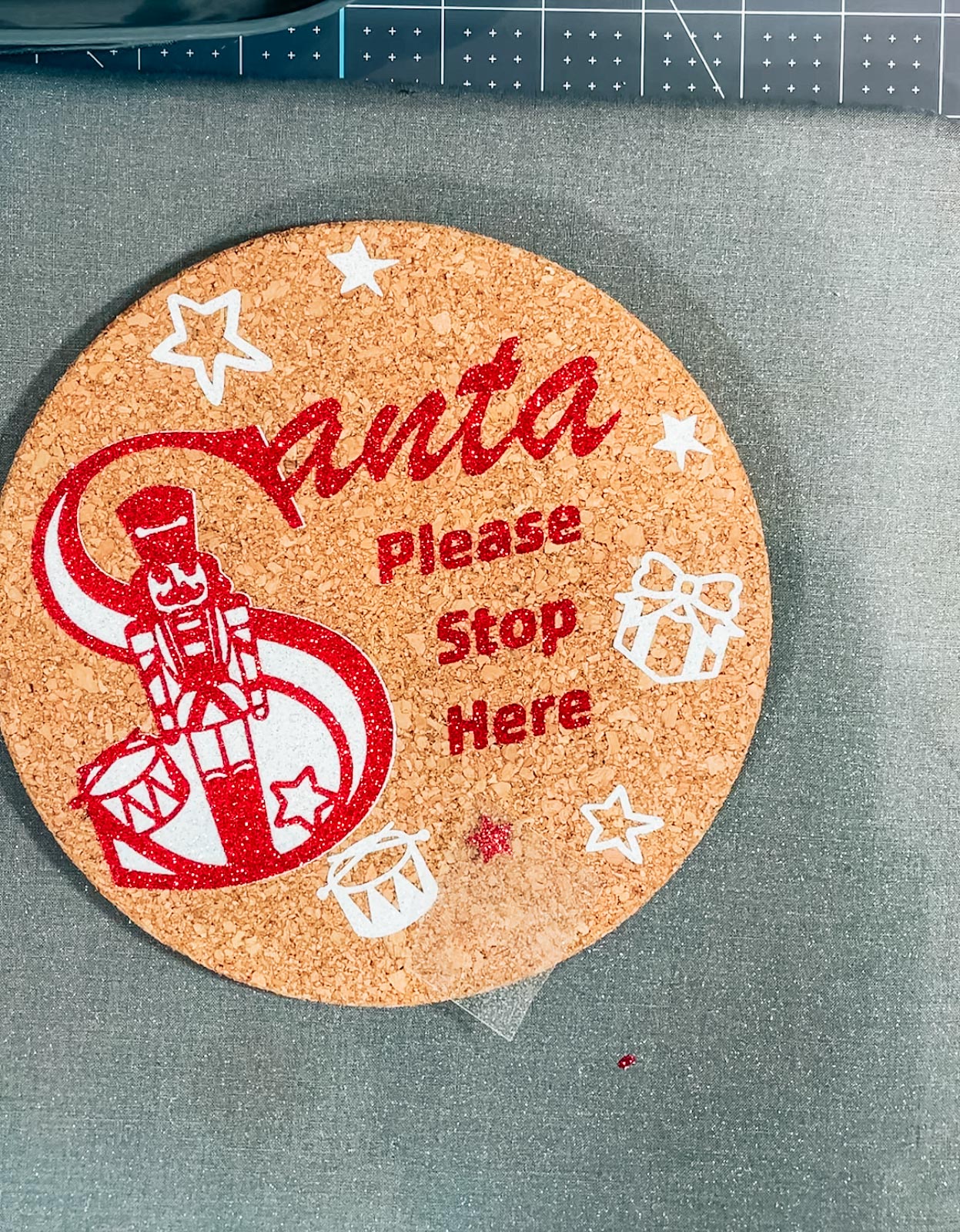 Santa stop here sign with a cork placemat
