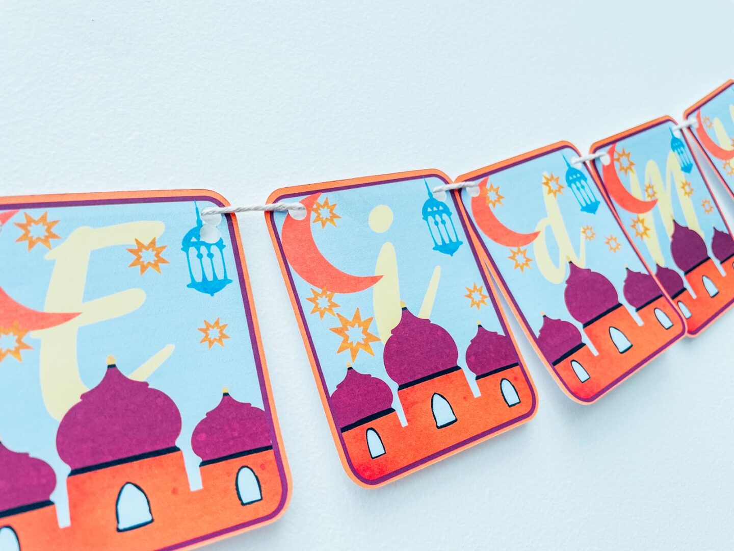 Bunting with a sky scene and mosque on