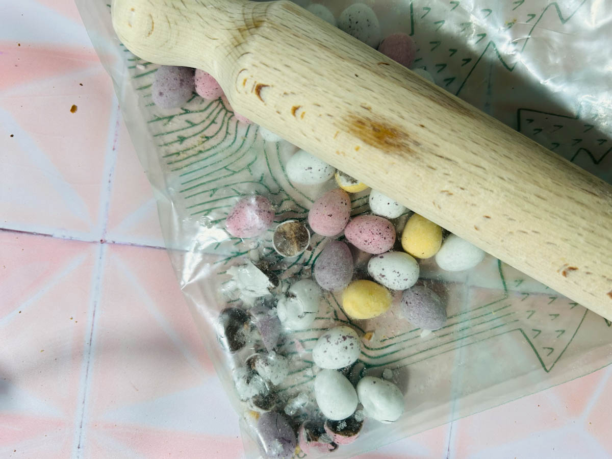 Break the mini eggs down with a rolling pin
